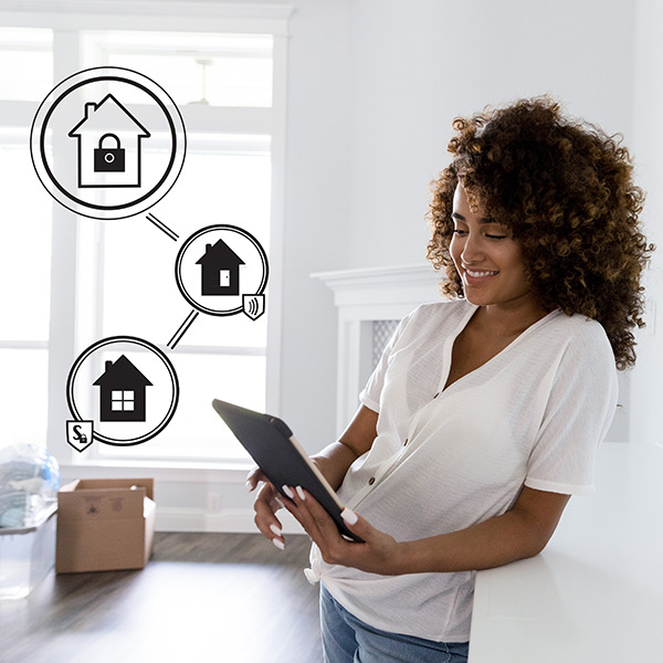 Woman programs automated home security with a digital tablet