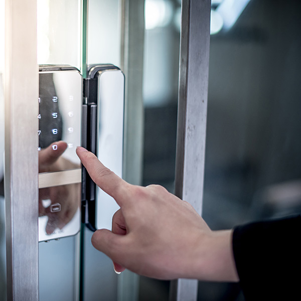 Pressing down password number on electronic access control machine