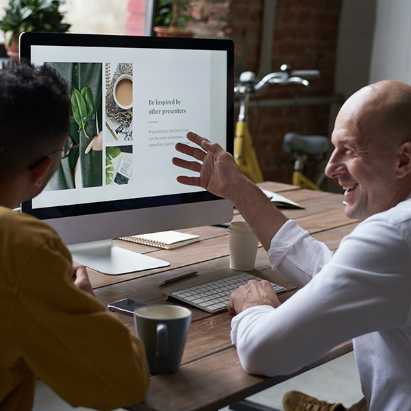 Man explaining a chart to another person